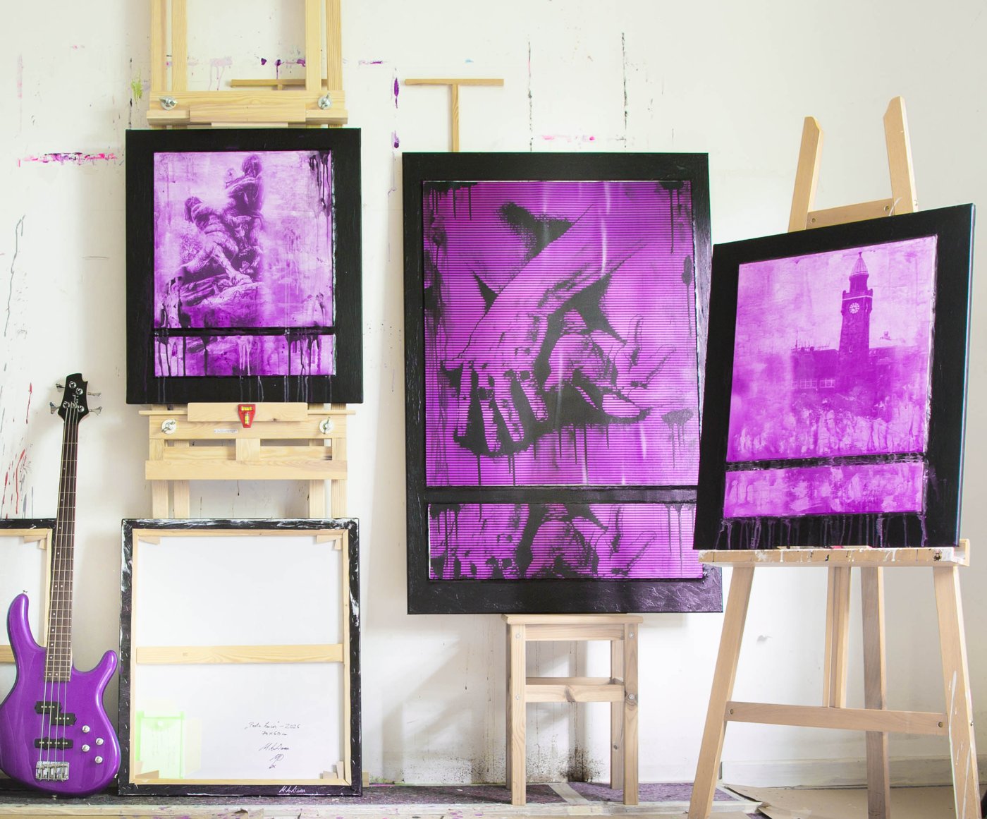 Three works on easels in the studio